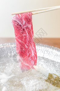 蒸汽火锅牛肉瓦格玉A5沙布沙布与蒸汽,石锅日本火锅美食背景