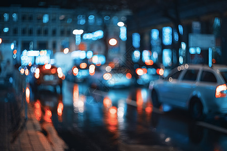 夜晚模糊的城市博克美丽的抽象场景与分散的建筑物,汽车,城市灯,人五颜六色的背景与城市夜景背景古董图片