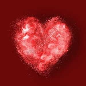 红色背景上粉末爆炸的心脏图片