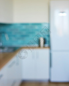 现代,明亮,干净的厨房内部与锈钢电器模糊的背景自然镜头博克现代,干净,厨房内部图片
