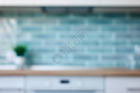 自然镜头bokeh蓝色瓷砖清洁厨房的模糊抽象背景模糊的景色厨房模糊视图图片