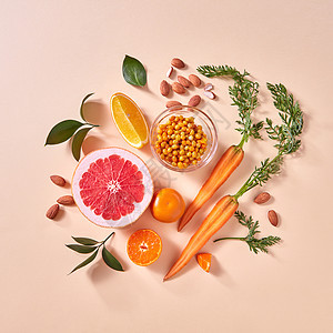 健康素食橙色机蔬菜水果的纸张背景的风景机天然素食的天然机柑橘类水果,胡萝卜,沙棘浆果黄纸背景下制图片