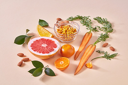 机素食成分,用于烹饪健康的冰沙橙色蔬菜水果橙色的纸张背景健康的饮食天然新鲜采摘的水果柑橘类水果,胡萝卜,沙棘浆果图片