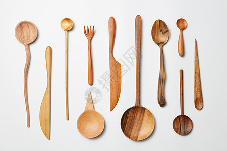 白色背景上的木勺子,刀,叉子木制勺子,叉子图片
