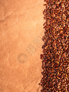 健康饮食机营养棕色原亚麻籽亚麻籽边框纸背景上图片