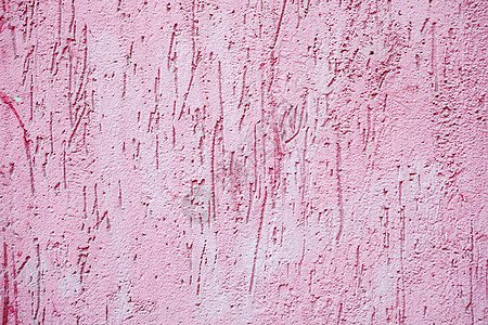 粉红色油漆粗糙的混凝土墙背景纹理背景图片