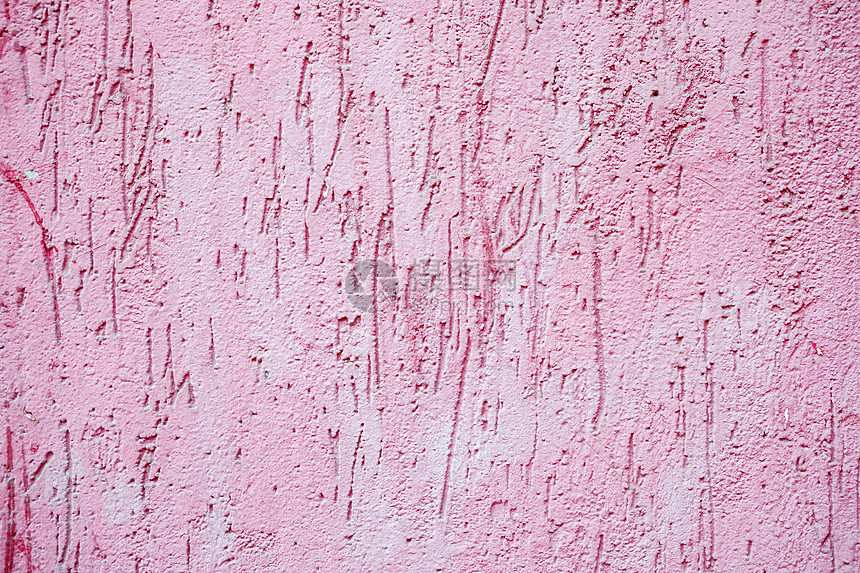 粉红色油漆粗糙的混凝土墙背景纹理图片