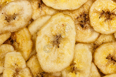 香蕉片,脱水片新鲜成熟香蕉食物背景香蕉薯片背景图片