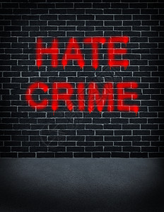 红色涂鸦的黑灰砖墙表达了仇恨犯罪社会问题图片