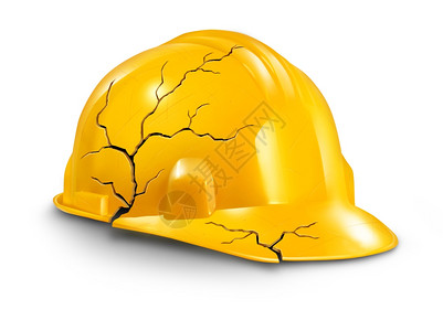 以破碎的黄硬头盔作为工伤和保险的象征对工人造成身体损害和痛苦图片