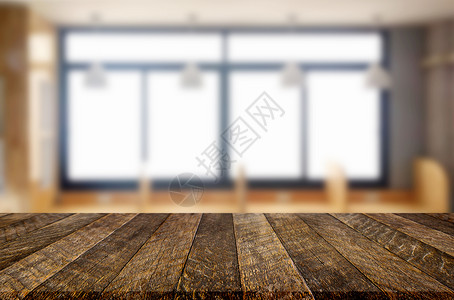 木板桌面清晨背景中窗口玻璃的模糊位置上空木板表用于照片补装或产品显示背景