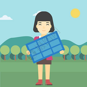 一位年轻女手持太阳能电池板图片