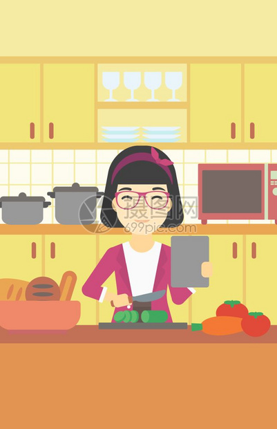 按照教程在厨房做健康沙拉的女人图片