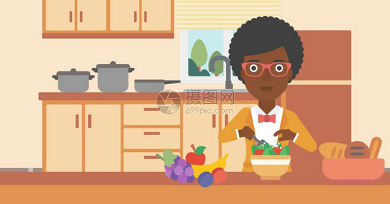 一位烹饪蔬菜沙拉的黑人图片