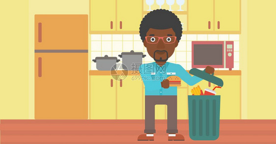 厨房里把垃圾食品放进垃圾桶的非裔男子图片