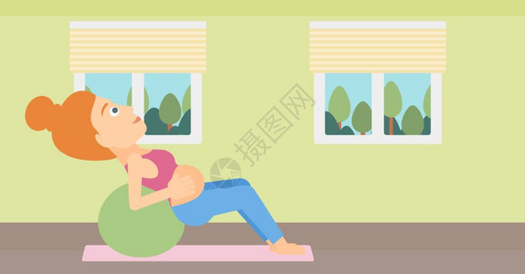 在室内进行锻炼的年轻孕妇图片