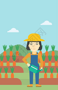 为胡萝卜浇水的女性农妇图片