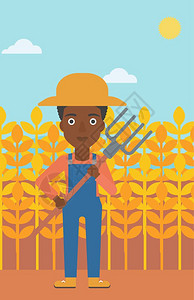 站在小麦田里的非裔女性农民图片