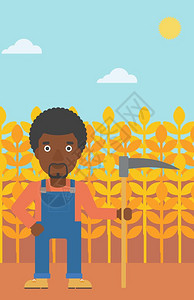手持镰刀站在小麦田里的非裔农民图片