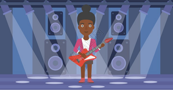 一位在舞台上玩电吉他的非裔女子图片