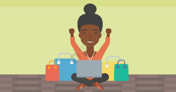 一名用笔记本电脑在网上购物的非裔女子图片