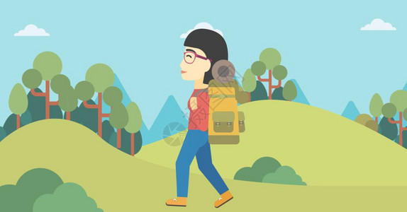 一位在山上徒步的女性背包客图片