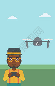 一名遥控无飞机的非裔男子图片