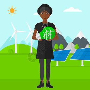 绿色发电厂旁手握绿色概念灯泡的非裔女子图片