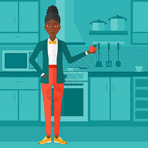 在厨房中手持苹果的非裔女子图片