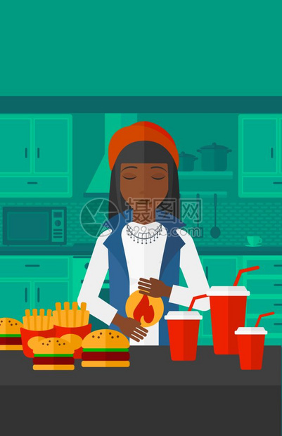 一位站在厨房快餐前感到胃痛的非裔女子图片