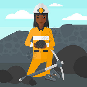 一位手持煤炭的非裔女矿工图片
