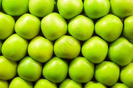 有序排列的绿苹果背景图片