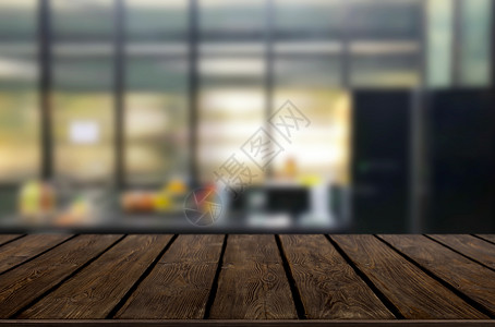 木板桌面在模糊的厨房或咖啡厅室背景上的木质桌子顶部用于蒙太奇产品显示设计关键视觉布局背景