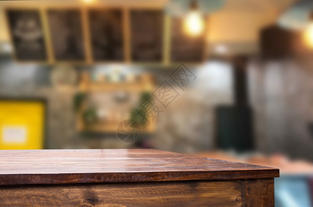 选中的空焦点棕色木制桌和咖啡店或restaun模糊背景带有bokeh图像用于您的相片补装或产品显示图片