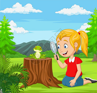 小女孩在花园里用放大镜看青蛙图片