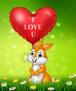 可爱的小兔子拿着红心气球在绿草上图片