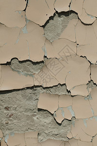 旧的破碎墙壁倒塌的石膏垂直纹理图片