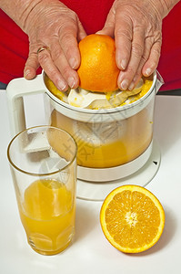 橙汁加挤压器图片