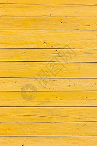 用亮黄色涂漆的旧水平木板垂直图片图片