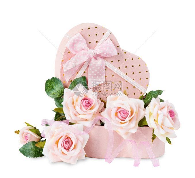 物盒边上的粉玫瑰图片