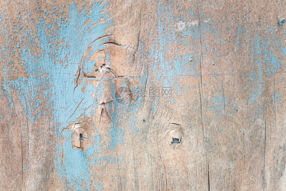 多彩背景含蓝色涂料粉碎和裂纹质的木表面图片