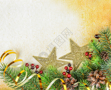 在旧纸的背面上带有fir树枝和金星的圣诞节成像图片