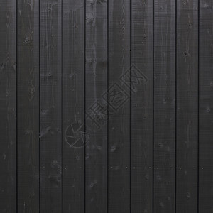 由建筑木制部分的垂直黑色木板构成的背景图片