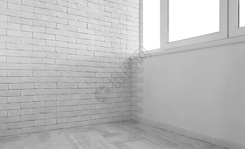 白色砖墙和旧木板地的古老内装房空旧图片
