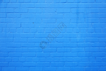 亮天空水平部分蓝色油漆砖墙高清图片