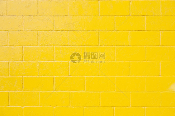 亮黄色油漆砖块墙水平部分图片