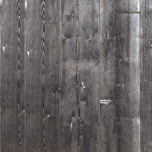 由旧的垂直木板组成的棚墙正方形部分涂有淡色黑灰漆或图片