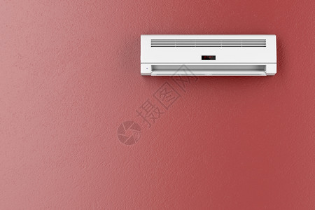红色墙壁上的分裂系统空调器图片