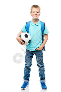 快乐的男孩拿着足球摆姿势背景图片