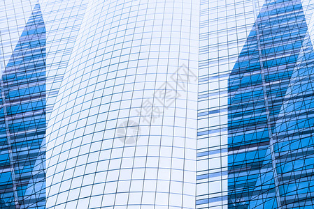 封闭建筑摩天大楼的窗户玻璃和混凝土城市景观商业区现代抽象背景高楼和摩天大的玻璃面图片